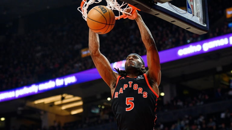 Toronto Raptors forward Precious Achiuwa dunks against the Miami Heat...