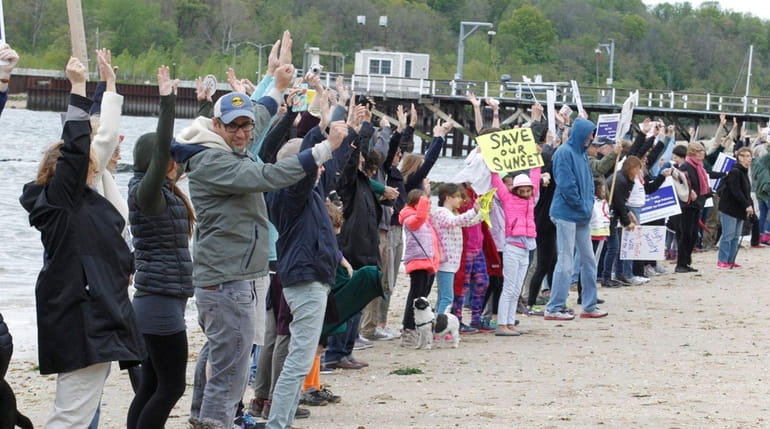 Sea Cliff residents protest against neighboring Glen Cove's waterfront development...