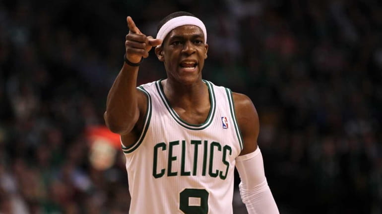 Rajon Rondo #9 of the Boston Celtics gestures as he...