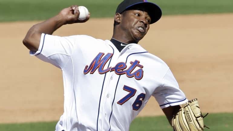 New York Mets relief pitcher Jennry Mejia throws to the...