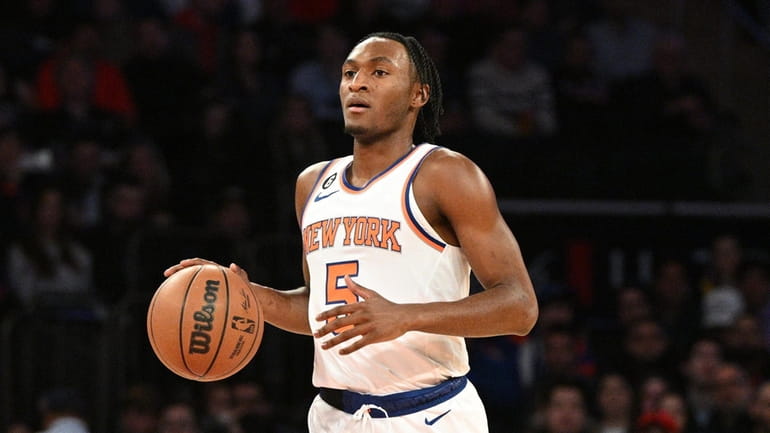 Knicks guard Immanuel Quickley controls the ball against the Indiana...