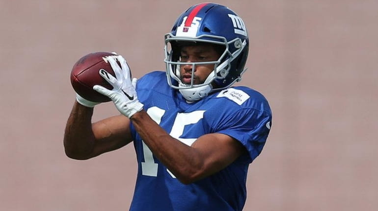 Giants wide receiver Golden Tate catches a pass during training...