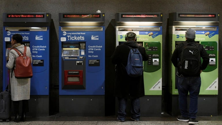 Riders buy train tickets at Penn Station in 2018. The...