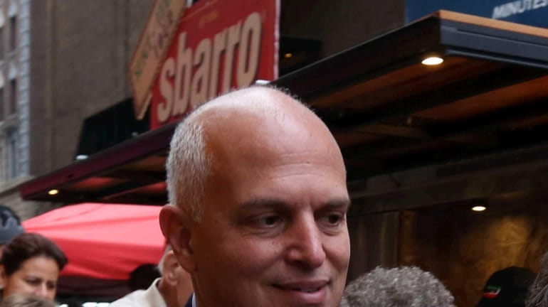 Anthony Missano, president of business development at Sbarro, chats outside...