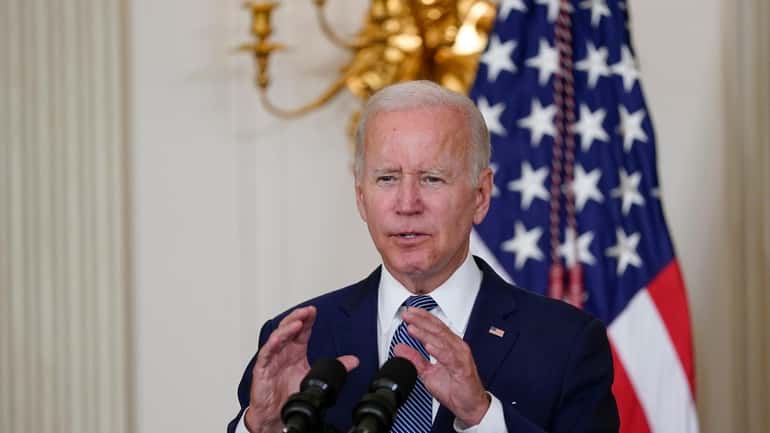 President Joe Biden speaks before signing the Democrats' landmark climate...