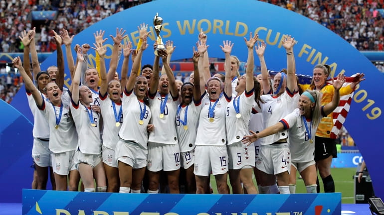 Team USA celebrates after winning the Women's World Cup soccer...