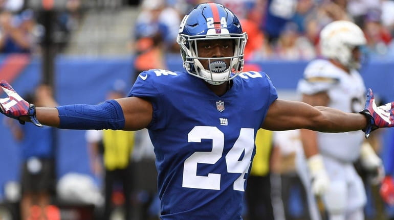 Giants cornerback Eli Apple reacts to a call against the...