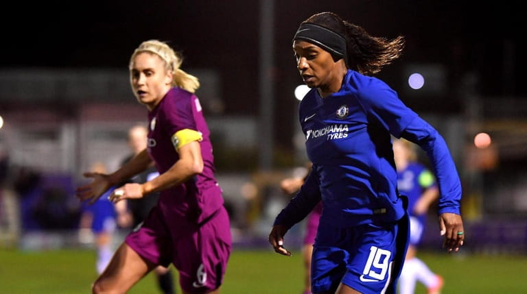 Crystal Dunn of Chelsea Ladies goes past Steph Houghton of...