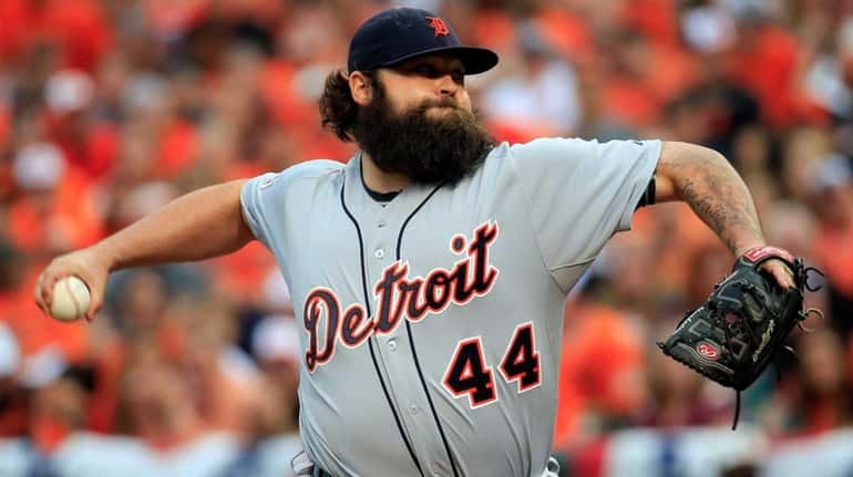 Joba Chamberlain of the Detroit Tigers throws a pitch in...