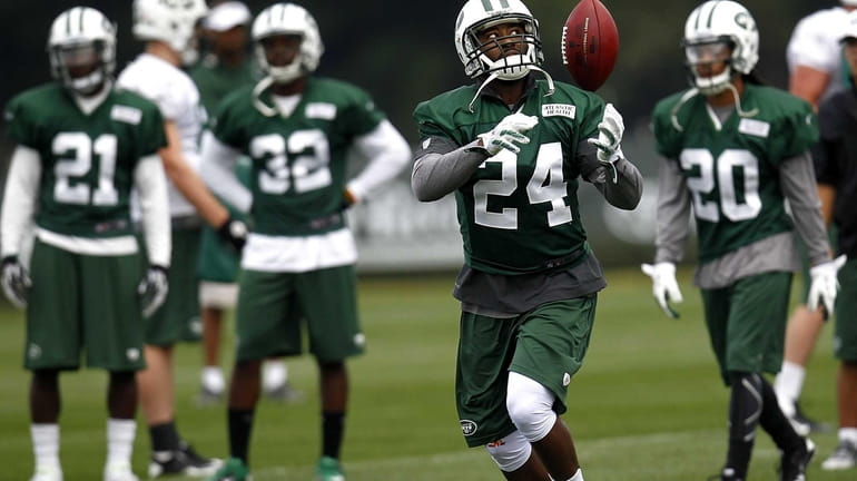 Darrelle Revis works out during the first day of Jets...