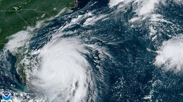 Hurricane Dorian sits over the Bahamas early on Tuesday.