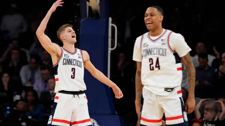 Connecticut's Joey Calcaterra, left, celebrates with Jordan Hawkins after making...