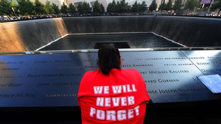 Friends and family members gather Sept. 11, 2013, at the Sept....