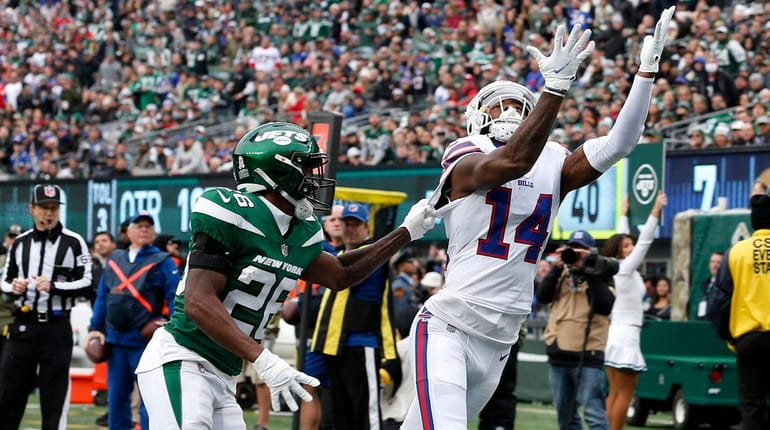 Stefon Diggs of the Bills attempts a catch in the end...