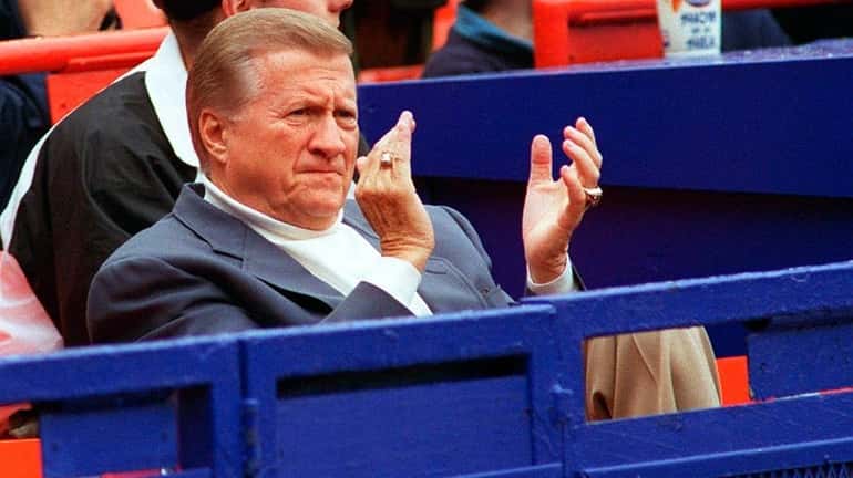 George Steinbrenner claps from the stands while watching the Yankees...