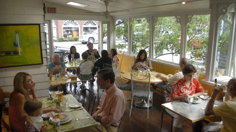 The enclosed patio at The Bellport restaurant, located at 159...