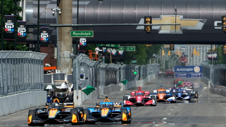 Cars practice for the IndyCar Detroit Grand Prix auto race...