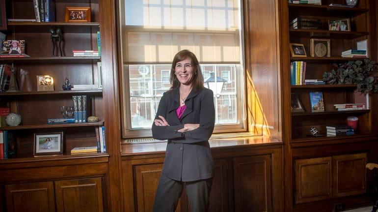 Christine M. Riordan, Adelphi University's 10th president, in her office...