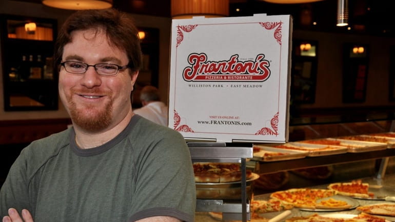 Reid Fishler stands in Frantoni's pizzeria in East Meadow, a...