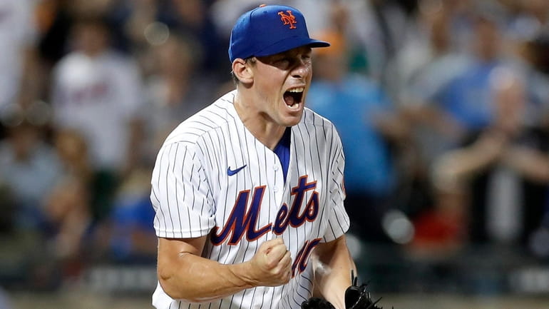 Chris Bassitt #40 of the Mets reacts after the final out...