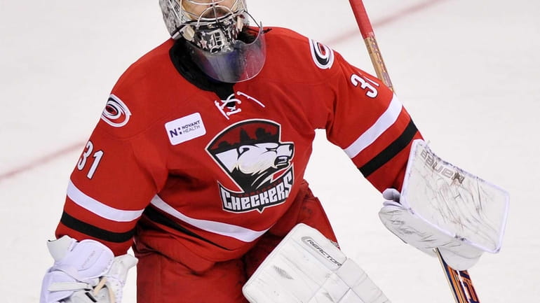 Charlotte Checkers goalie Rick DiPietro stands in net.