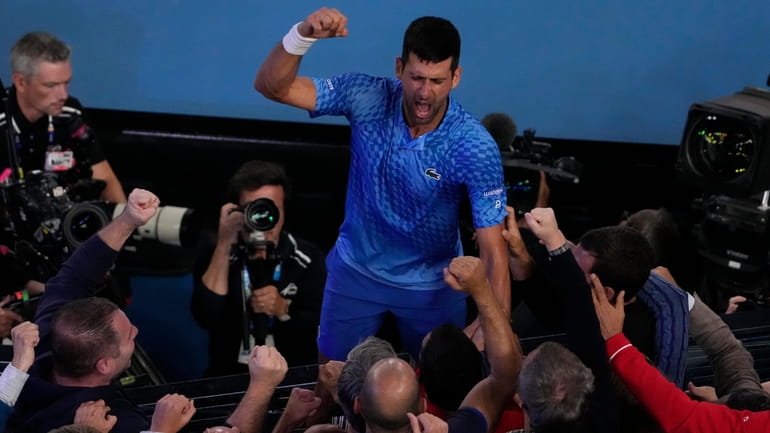 Novak Djokovic celebrates after defeating Stefanos Tsitsipas in the men's...