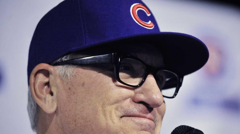 Chicago Cubs manager Joe Maddon answers questions during a press...