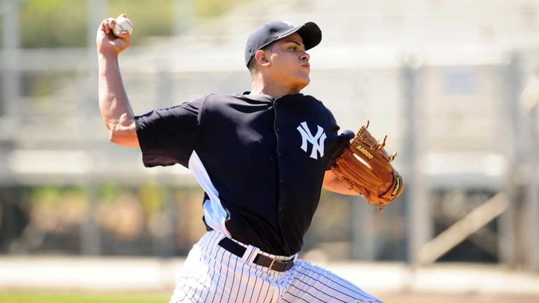Portrait of New York Yankees Dellin Betances throws live batting...