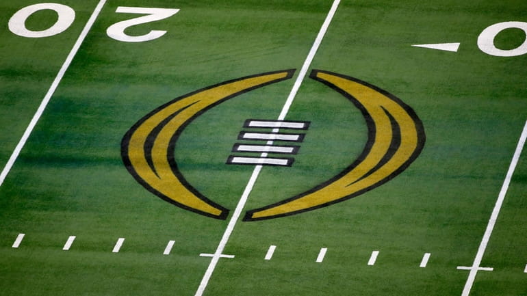 The College Football Playoff logo is shown on the field...