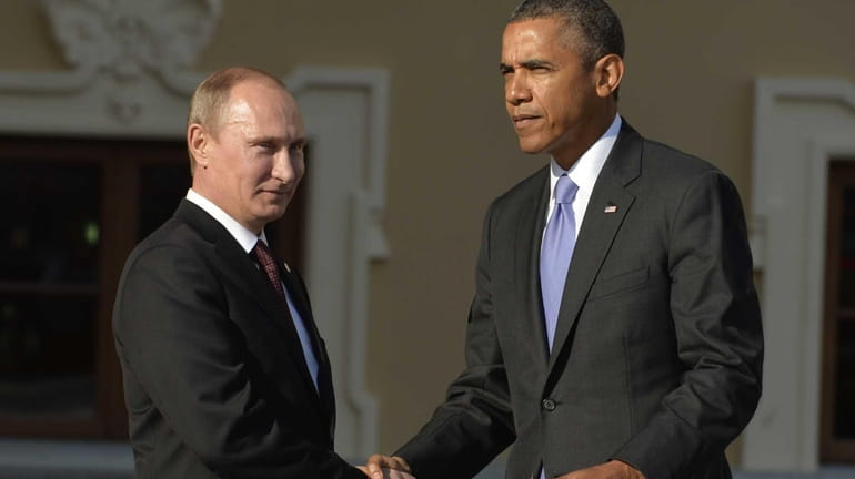 Russias President Vladimir Putin welcomes President Barack Obama at the...