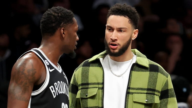 Brooklyn Nets guard Ben Simmons, right, talks to forward Dorian...