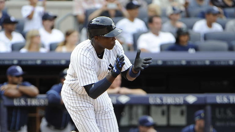 Alfonso Soriano reacts after he hitting a game-winning RBI single...