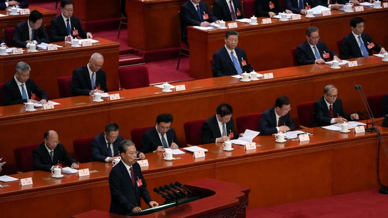 Zhao Leji, chairman of the NPC Standing Committee, delivers a...