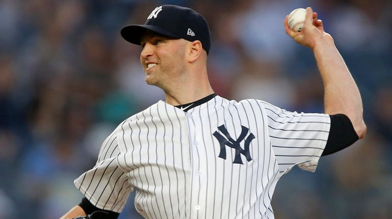 Yankees pitcher J.A. Happ delivers in the first inning against the Rays...