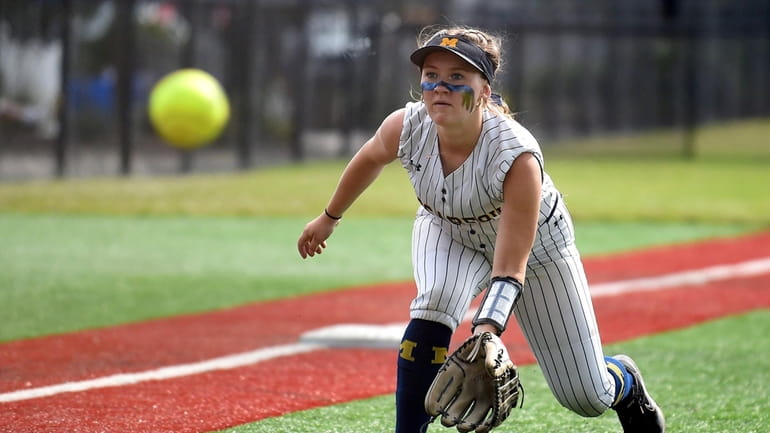 Katie Stork #2 of Massapequa charges from third base to...