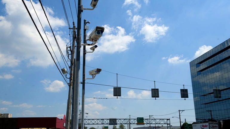 Red light cameras monitor drivers on Old Country Road near...