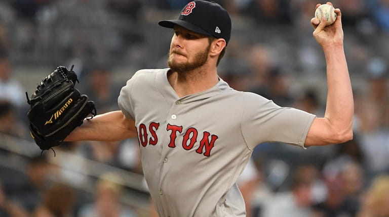 Boston Red Sox starting pitcher Chris Sale delivers a pitch...