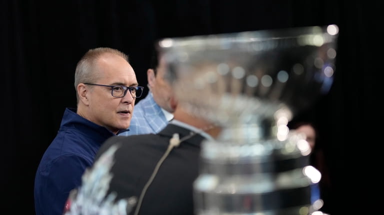 Florida Panthers head coach Paul Maurice speaks with members of...