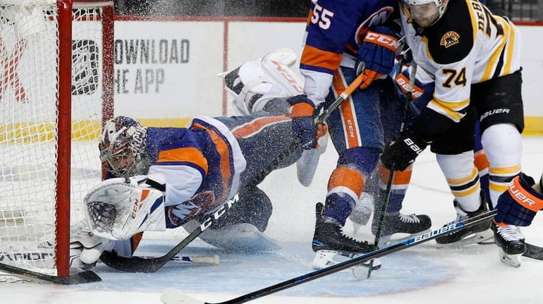 Semyon Varlamov  of the New York Islanders stops a scoring...