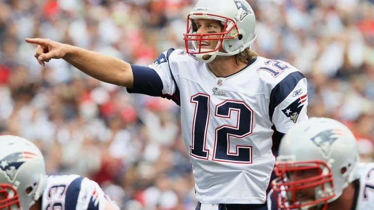 Tom Brady #12 of the New England Patriots calls out...