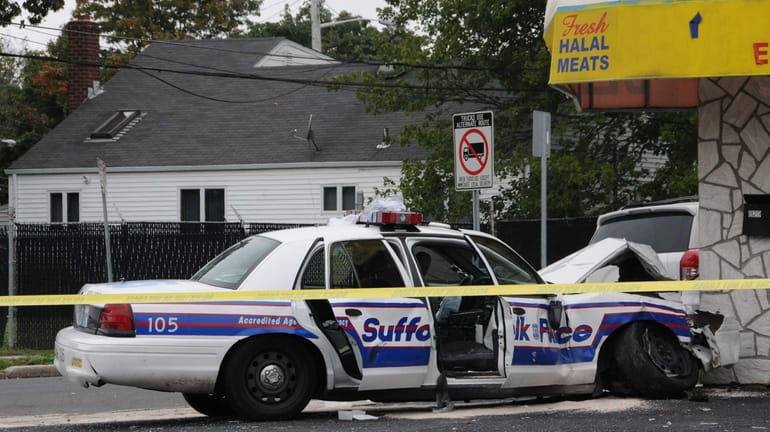 A police car sits in front of a restaurant after...