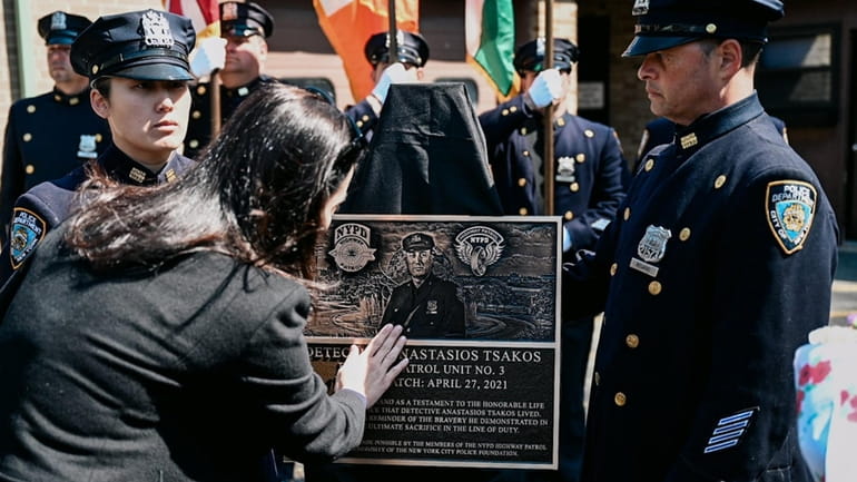 A plaque and sidecar are dedicated in honor of NYPD...