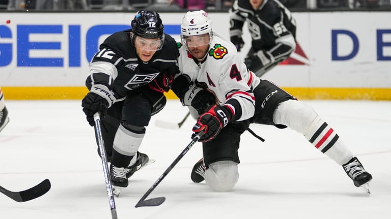 Los Angeles Kings left wing Trevor Moore (12) and Chicago...