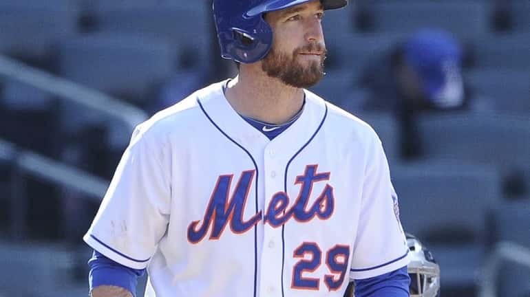 New York Mets Ike Davis strikes out looking in the...