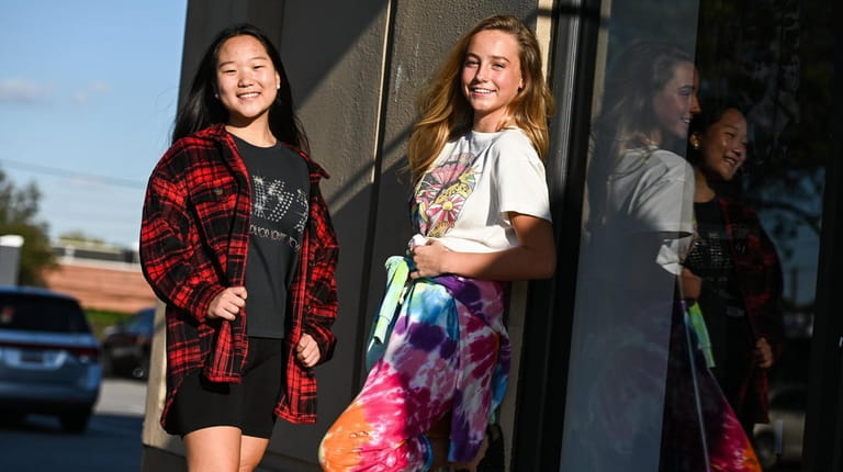 Anna Limb, wearing a flannel, left, and Carys Hyland, wearing...