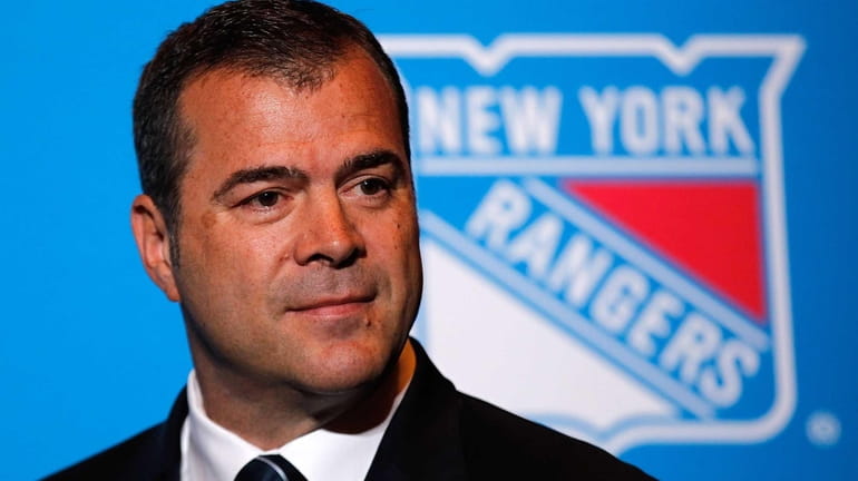 Alain Vigneault speaks to the media after being introduced as...