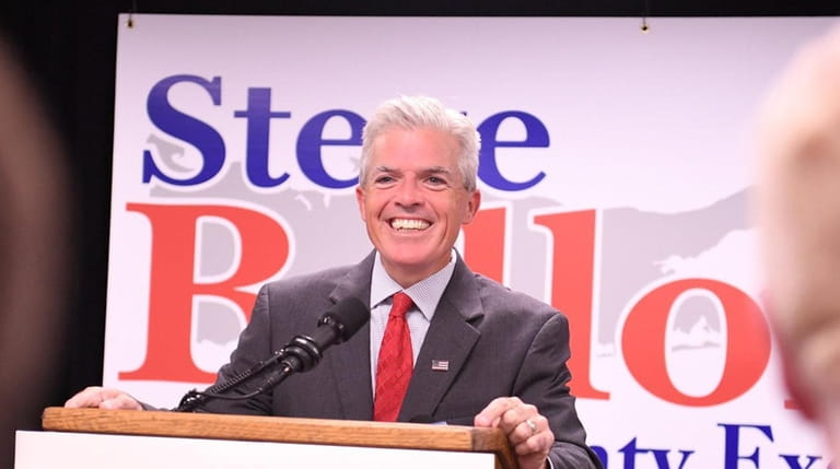 Suffolk County Executive Steve Bellone walks in to supporters after...