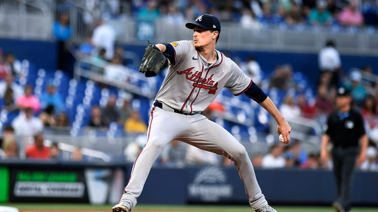 Atlanta Braves pitcher Max Fried throws to a Miami Marlins...