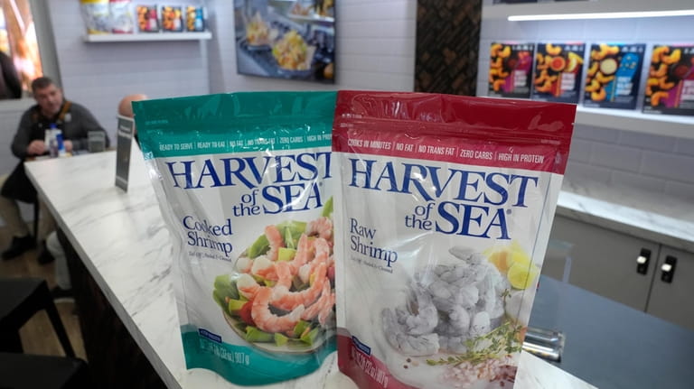 Harvest of the Sea shrimp packets are displayed on a...