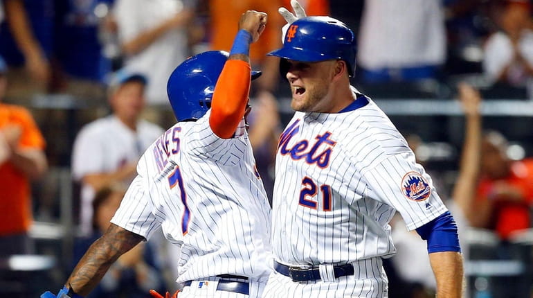 Lucas Duda of the Mets celebrates his home run with...